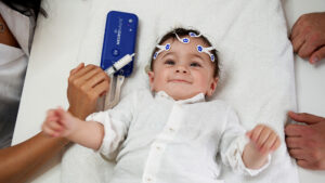 Baby doing an electroencephalography (EEG) with BIOSerenity devices